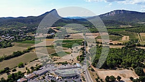 Drone footage over a small village at the foot of Pic Saint-Loup Mountain, France