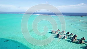 Drone footage of water villa bungalows in Bora Bora, Tahiti, French Polynesia