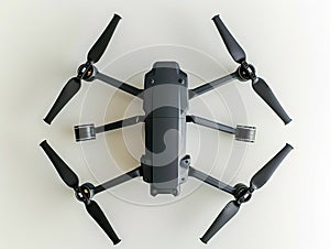 A drone with four propellers on top of a white surface photo