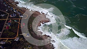 Drone, houses and ocean, nature and landscape for travel with coast and seascape, waves and surf. Sea, foam and shore