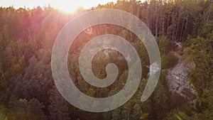 Drone image. aerial view of cliff with  forests in cloudy autumn day with yellow colored fall trees