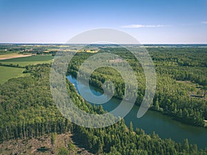drone image. aerial view of rural area lake in forest with green