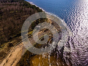 drone image. aerial view of rural area with rocky beach of Baltic sea
