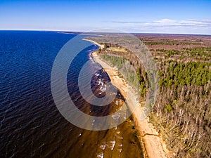 drone image. aerial view of rural area with rocky beach of Baltic sea