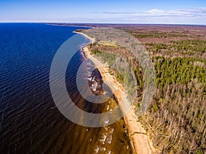 drone image. aerial view of rural area with rocky beach of Baltic sea