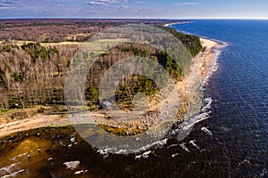 drone image. aerial view of rural area with rocky beach of Baltic sea