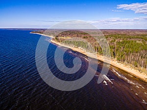 drone image. aerial view of rural area with rocky beach of Baltic sea