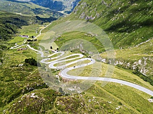 Drone image over the serpentine road through the Swiss Alps Julier Pass, Switzerland photo
