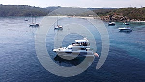 aereal view of private yachts and small boats anchored in a small bay in the Mediterranean sea