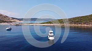 aereal view of private yachts and small boats anchored in a small bay in the Mediterranean sea