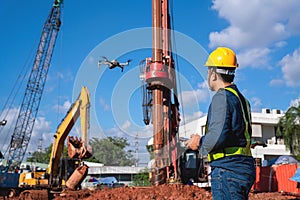 Drone inspection new construction site. Operator inspecting new construction site control by civil engineer