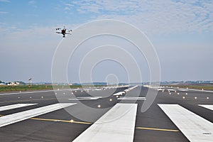 Drone inspection over airport runway photo