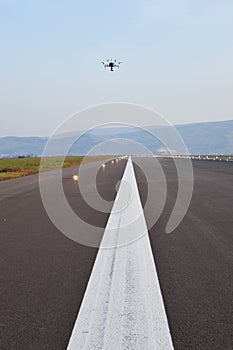 Drone inspection over airport runway photo