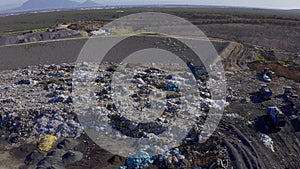 Drone, landfill and garbage truck for trash management and pollution, environment and junkyard. Aerial view of outdoor