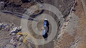 Drone, landfill with garbage truck and trash, waste management and pollution in junkyard environment. Aerial view of
