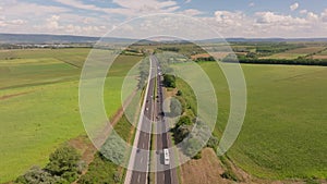 Drone motion over Austrian autobahn amid fields