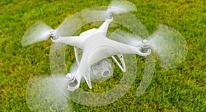 Drone operated by construction worker inspecting wind turbine