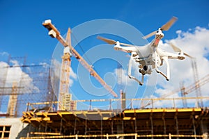 Drone over construction site. video surveillance or industrial inspection