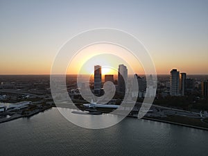 Drone over harbor with cityscape at seaside in Wisconsin at sunset