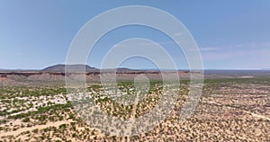 Drone pan over the famous Vingerklip rock needle in northern Namibia during the day