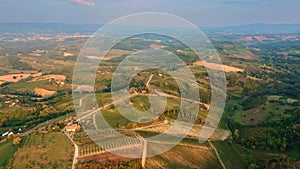 Drone panning over landscape near San Gimignano, Tuscany, Italy, at sunset