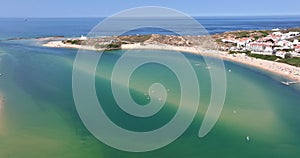 Drone panning over the Portuguese coastal town of Bairro Monte Vistoso and the Rio Mira