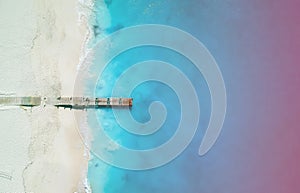 Drone panorama of pier in Grace Bay, Providenciales, Turks and Caicos with light leak