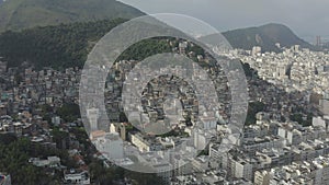 Drone, panoramic footage of favelas on the hills of the city of Rio de Janeiro