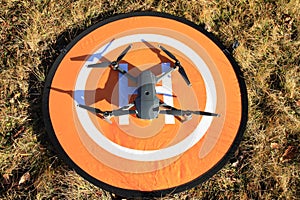 Drone parked on orange helipad
