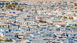 Drone photo of a community in Oakley, California with houses, cars, streets and solar