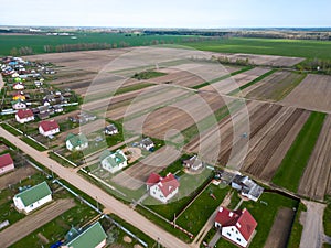 Drone photo of a plowed fields. Aerial view of a farmer's field. A top view of an agricultural field