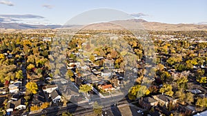 Drone  photo of Reno neighborhoods during the fall sesason looking towards the mountains photo
