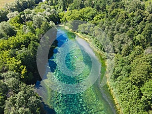 Drone photo of sup boarders on a forest lake. Mood of calmness and silence