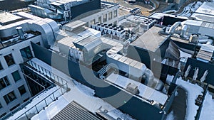 Drone photography of large air conditioning unit on a rooftop during winter day