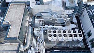 Drone photography of large air conditioning unit on a rooftop during winter day