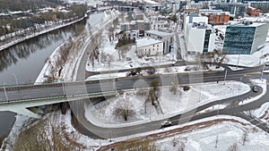Drone photography of multiple lane road going in a town during winter day