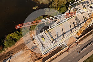 Drone photography of new office building construction site, cranes and construction workers