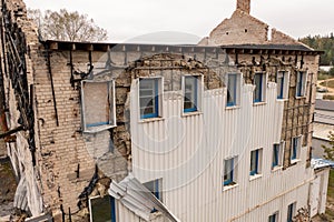 Drone photography of old abandoned factory house in ruins during autumn cloudy day