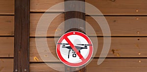 Drone photography prohibited sign on wooden wall background