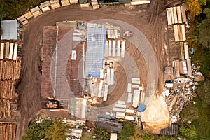 Drone photography of small lumberyard during autumn day