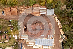 Drone photography of small lumberyard during autumn day