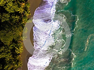 Drone photography. Spectacular beach, called Playa de bahÃÂ­a Drake en Corcovado, with palms and waves. Corcovado, Osa Peninsula photo