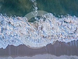 Drone picture of waves hitting the beach