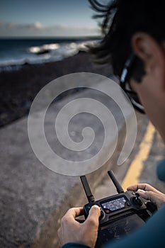 Drone pilot in action, taking aerial photos