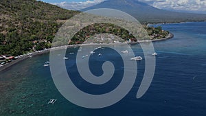 Drone point view to Amed beach and volcano Agung at background at sunny day