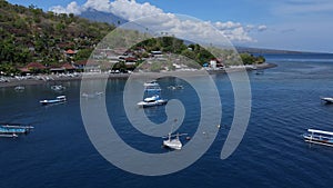 Drone point view to Amed beach and volcano Agung at background at sunny day
