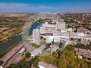 Drone pov, aerial view of industrial cityscape with factory buildings