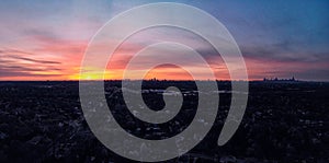 Drone POV: Colorful Chicago Skyline silhouette at Dawn