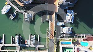 Drone, property and ocean with harbor in city for residential, infrastructure and house. Nature, environment and