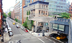 Drone quad copter with camera oversees the city streets photo